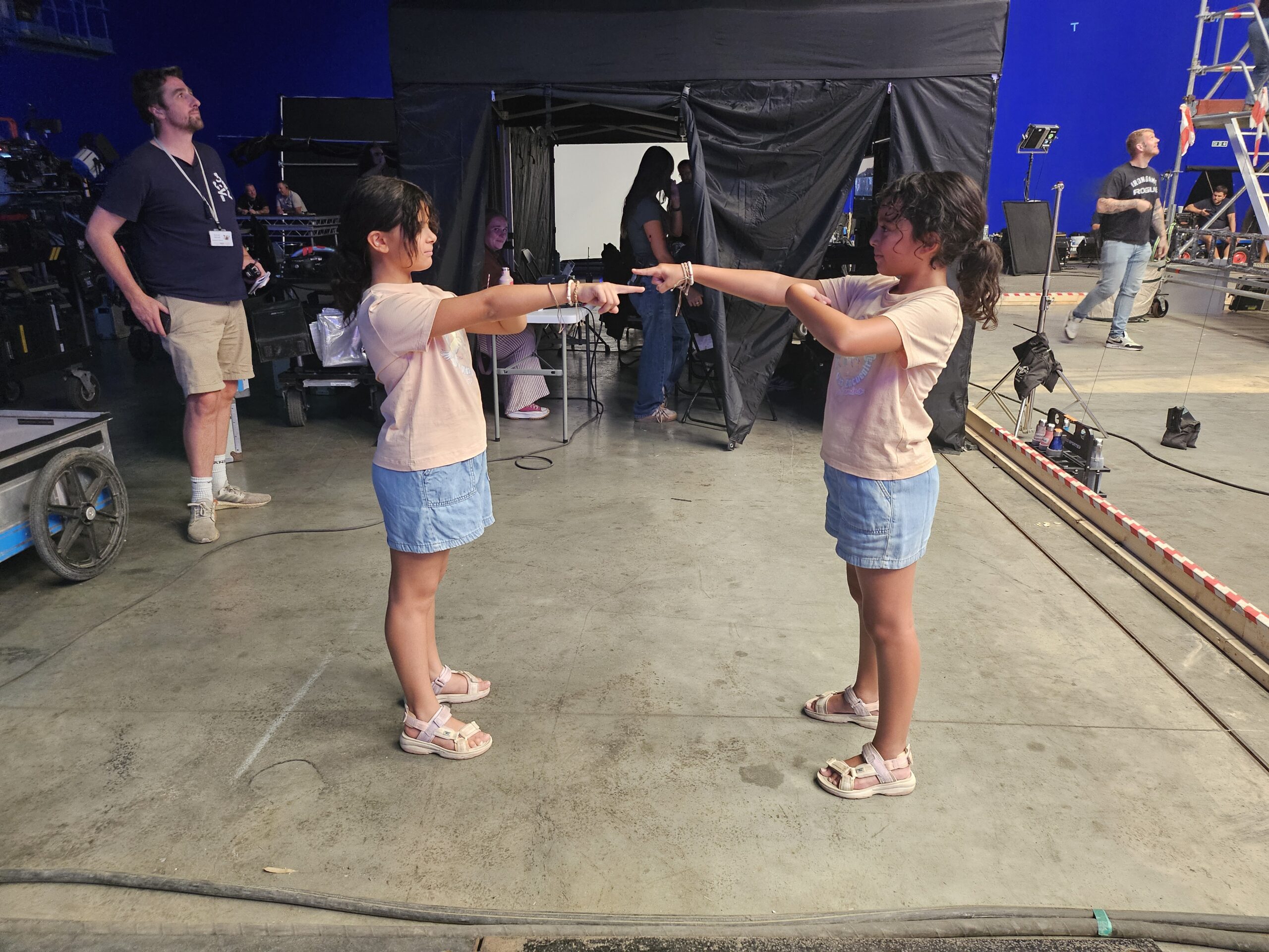 Audrina Miranda and body double Amber Joshi pointing at each other on the set of 'Jurassic World: Rebirth'