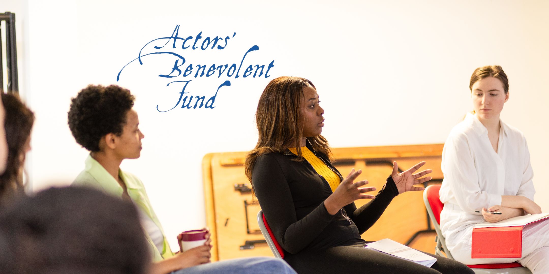 Performers sitting together talking