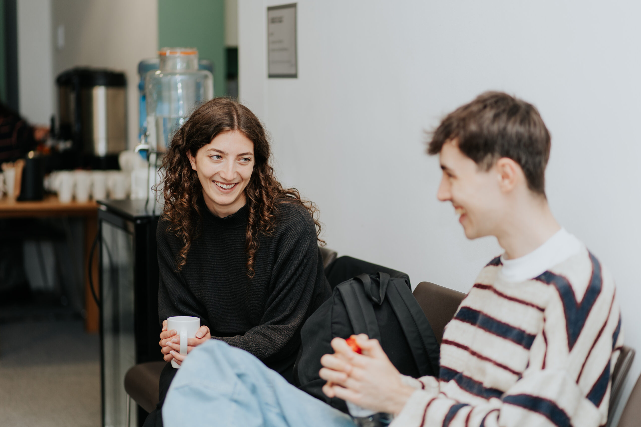Two drama school graduates having a chat with drinks