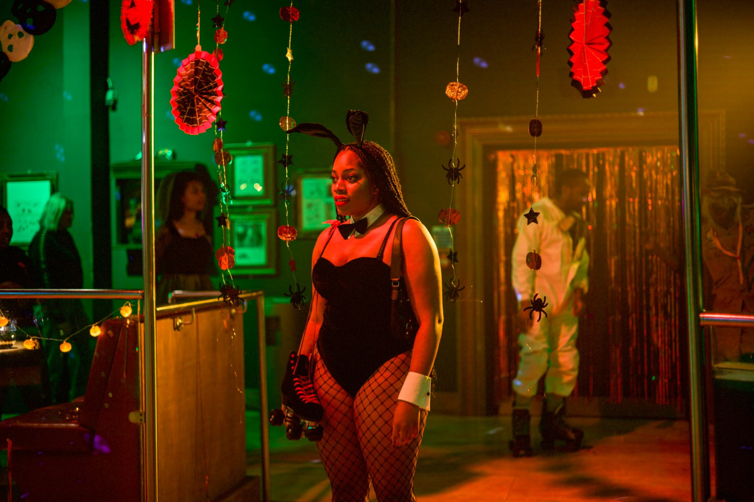 Queenie from 'Queenie' at a party dressed in bunny ears