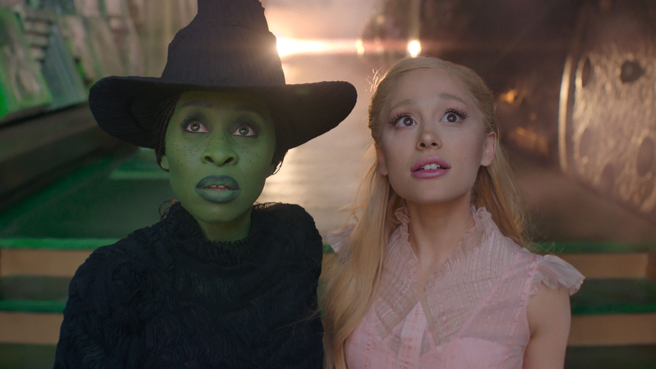 Cynthia Erivo and Ariana Grande as 'Elphaba' and 'Glinda' in 'Wicked' standing together and staring ahead with awe
