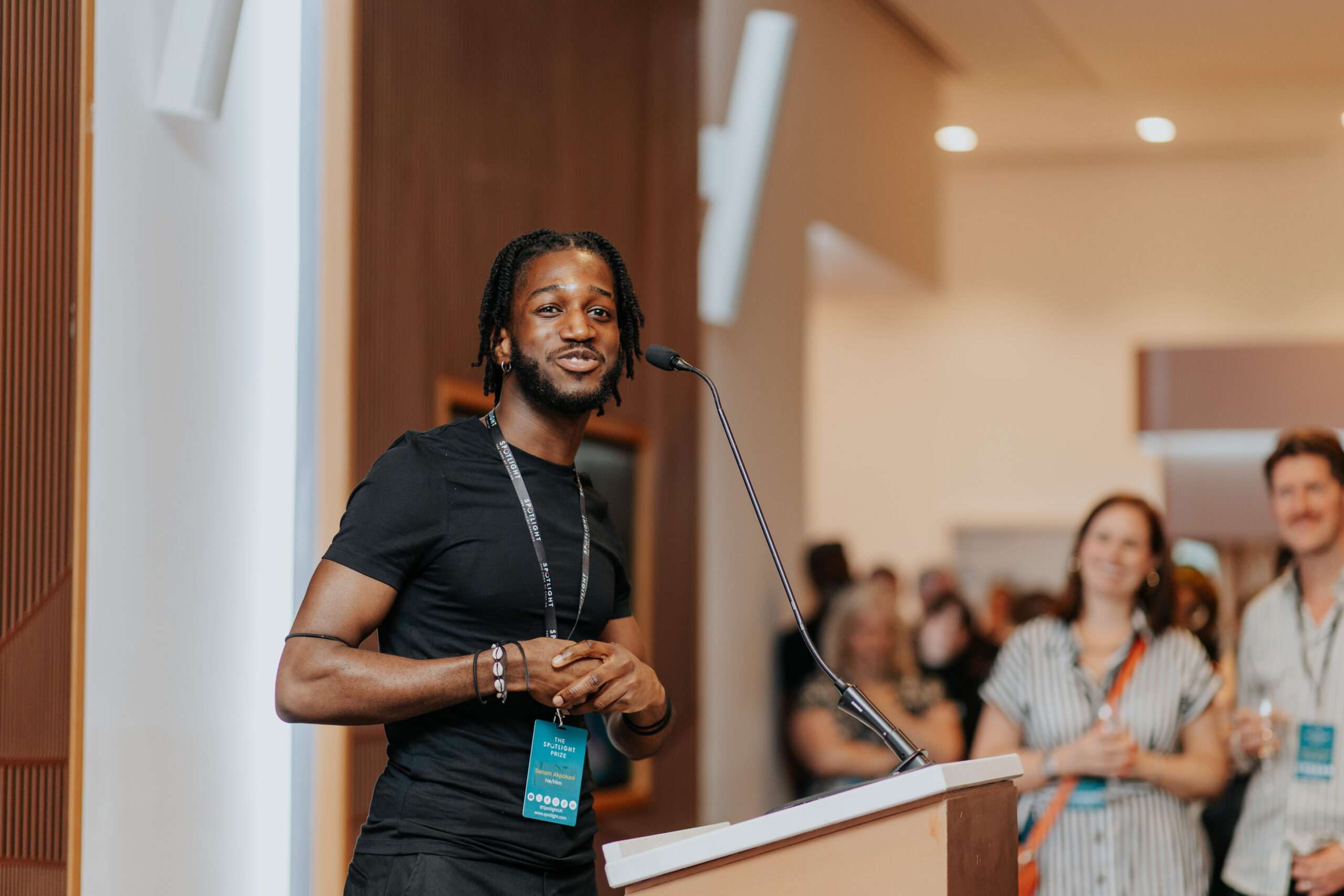 Senam Akpokavi giving a speech at the Spotlight Prize 2024 after winning the Screen Award.