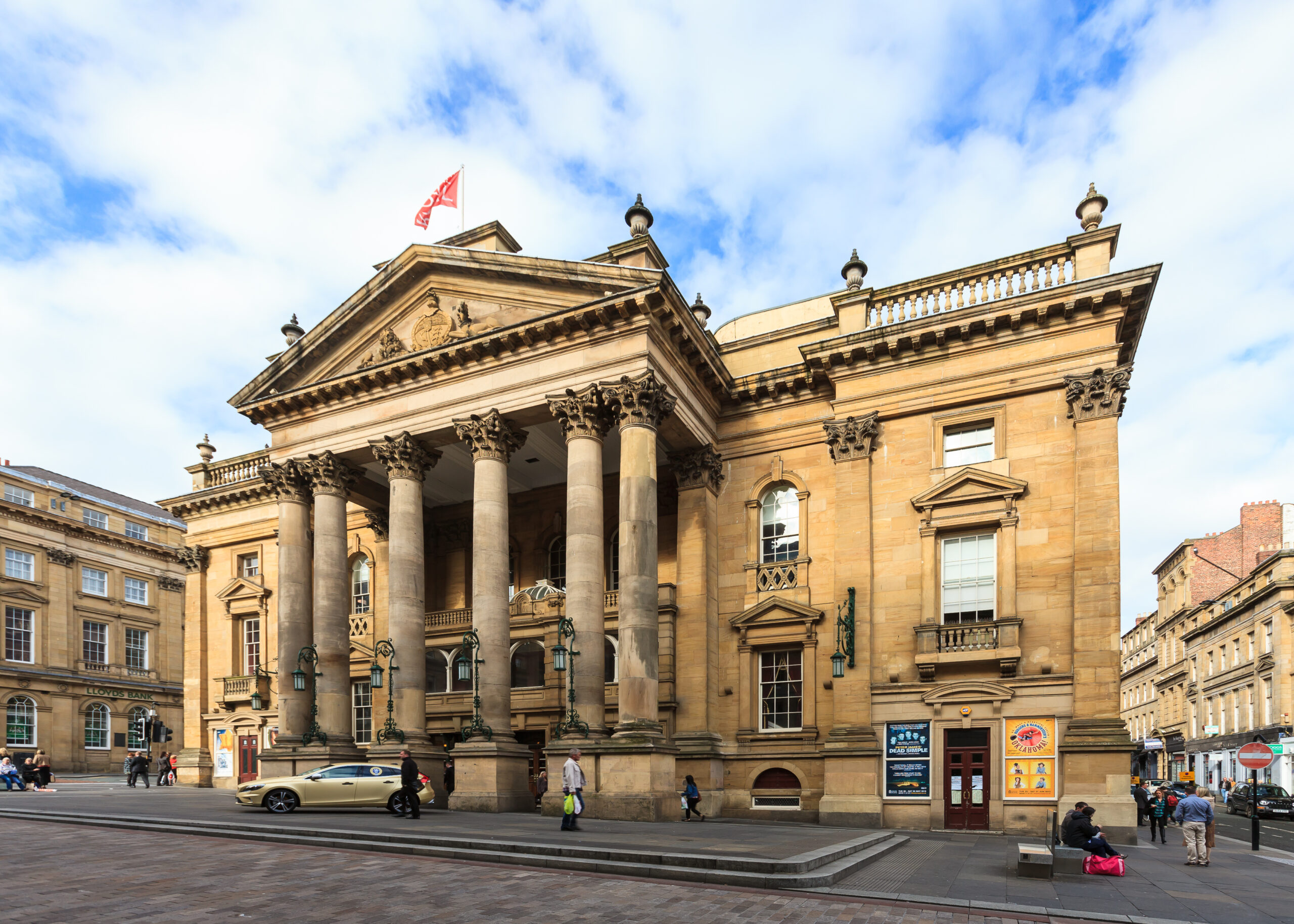 The Theatre Royal in Newcastle on a cloudy, blue sky day