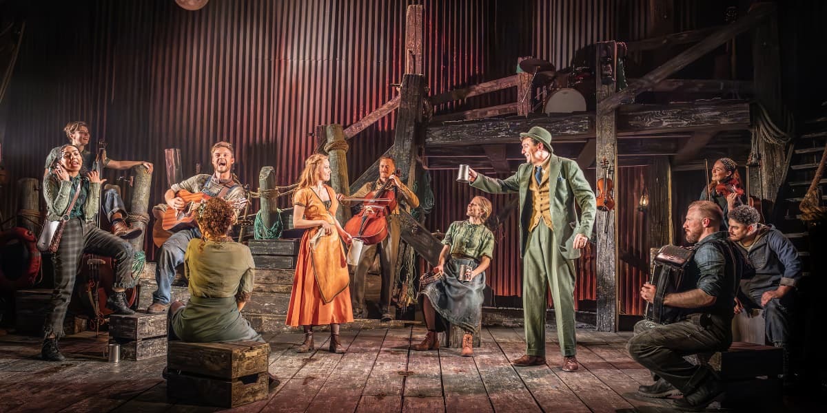 The cast of 'The Curious Case of Benjamin Button' the musical on stage toasting